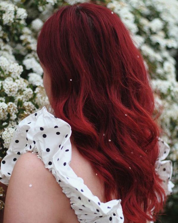 Deep cherry copper color on wavy hair